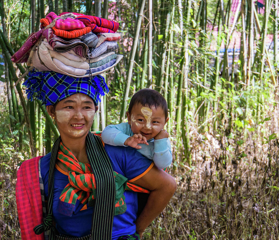 smiling Burmese mother with her laughing baby  Photograph by Ann Moore