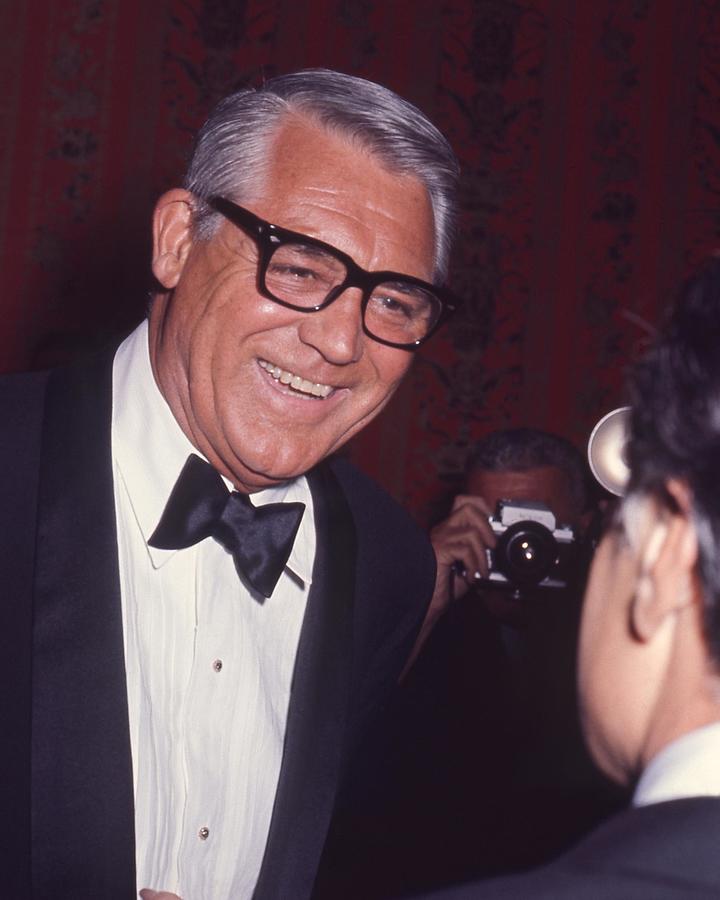 Smiling Cary Grant Looking And Talking Photograph by Globe Photos ...