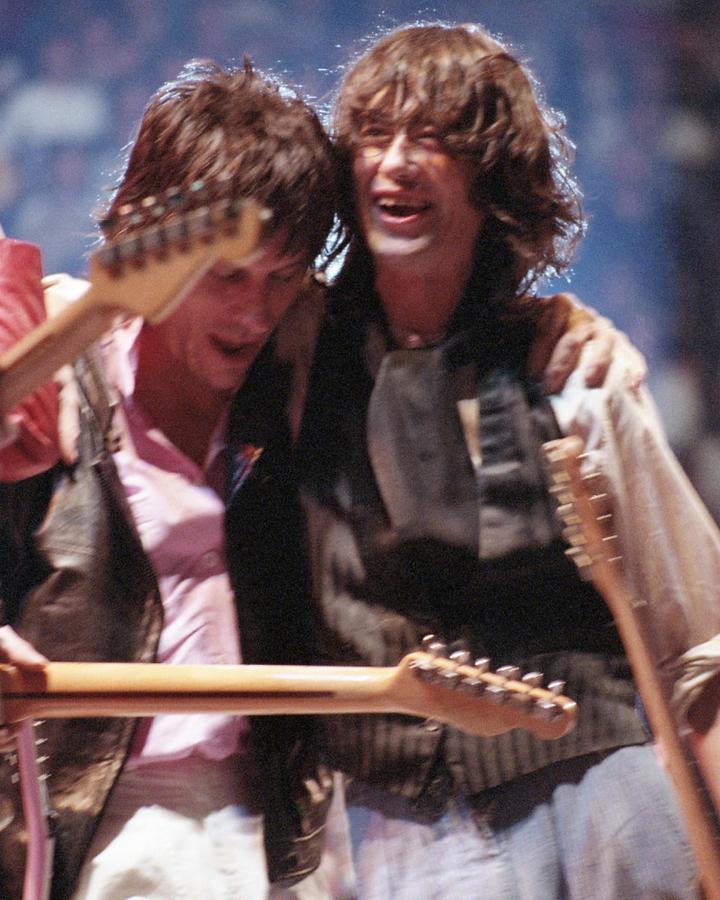 Jimmy Page Photograph - Smiling Jimmy Page And Jeff Beck Embracing On Stage At Arms Charity Concerts by Globe Photos