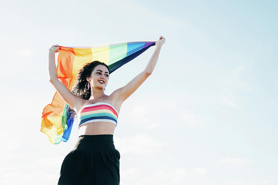 Smiling Woman Holding Lgbt Rainbow Flag Photograph By Cavan Images Fine Art America