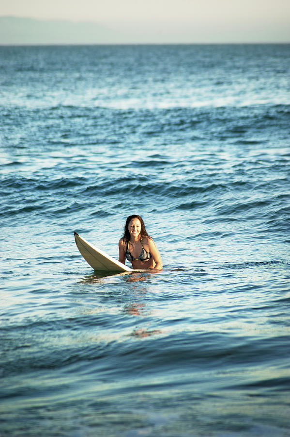 Nature Photograph - Smiling Woman Surfboarding In Sea by Cavan Images
