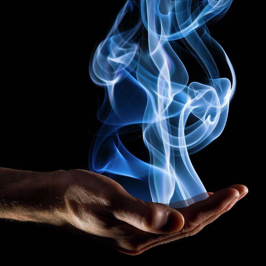 Smoke Wisps From A Hand Photograph by Design Pics/corey Hochachka