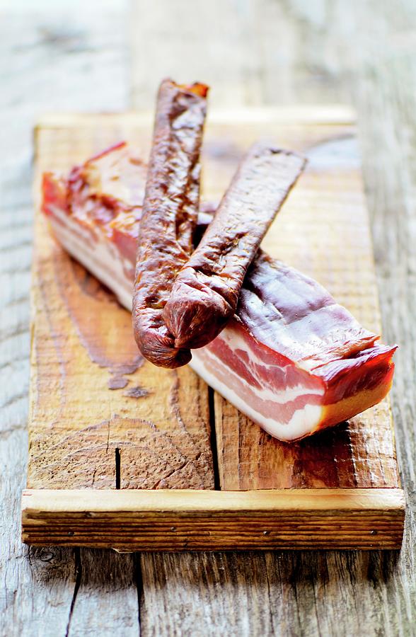 Smoked Pork Sausage On A Slice Of Smoked And Salted Pork france Photograph by Jamie Watson