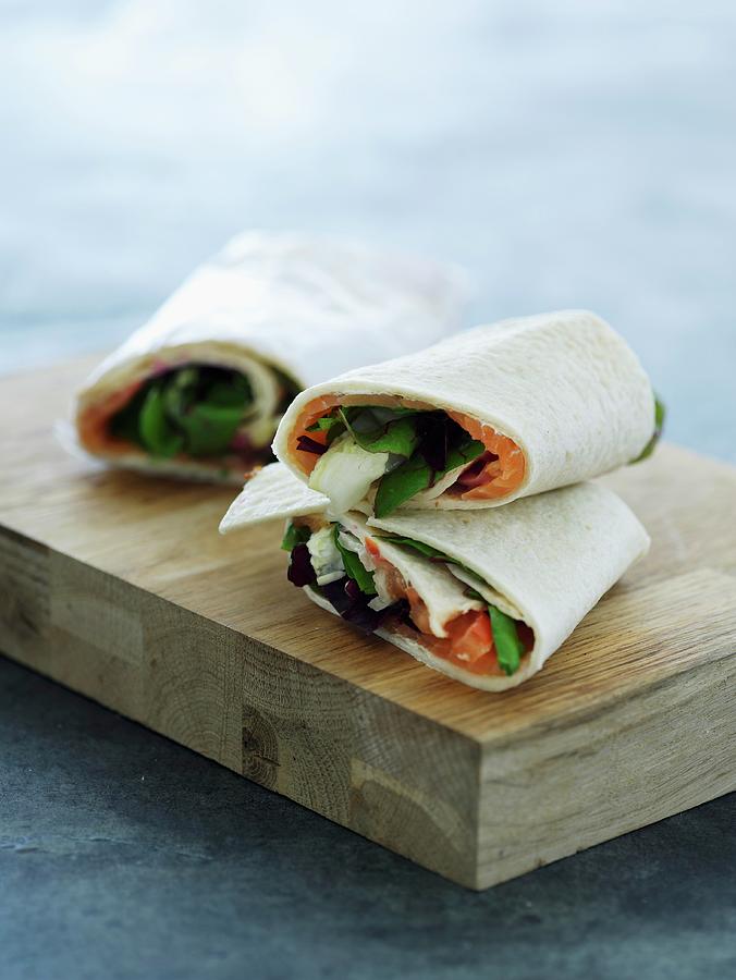 Smoked Salmon And Vegetable Wraps Photograph by Mikkel Adsbl