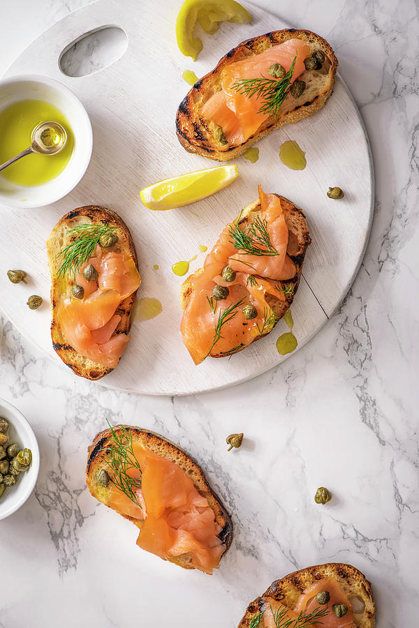 Smoked Salmon Crostini With Capers, Dill, Olive Oil And Lemon Photograph by Magdalena Hendey