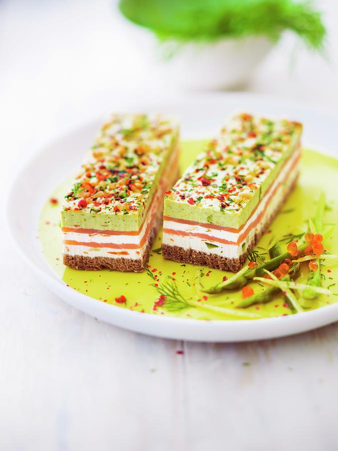 Smoked Salmon, Pesto, Fromage Frais And Spring Vegetable Layer On White Bread And Decorated With Almonds, Red Pepper And Parsley Photograph by Roulier-turiot