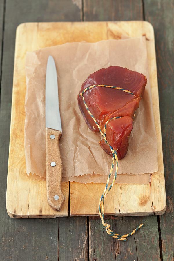 Smoked Tuna Fish On A Chopping Board Photograph by Rua Castilho