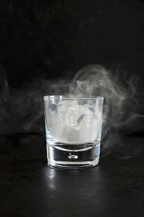 Smoking Ice In A Glass; Black Background Photograph by Rannells, Greg