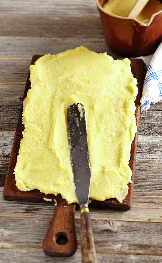 Smooth Boiled Polenta On A Moist Board Photograph by Teubner Foodfoto