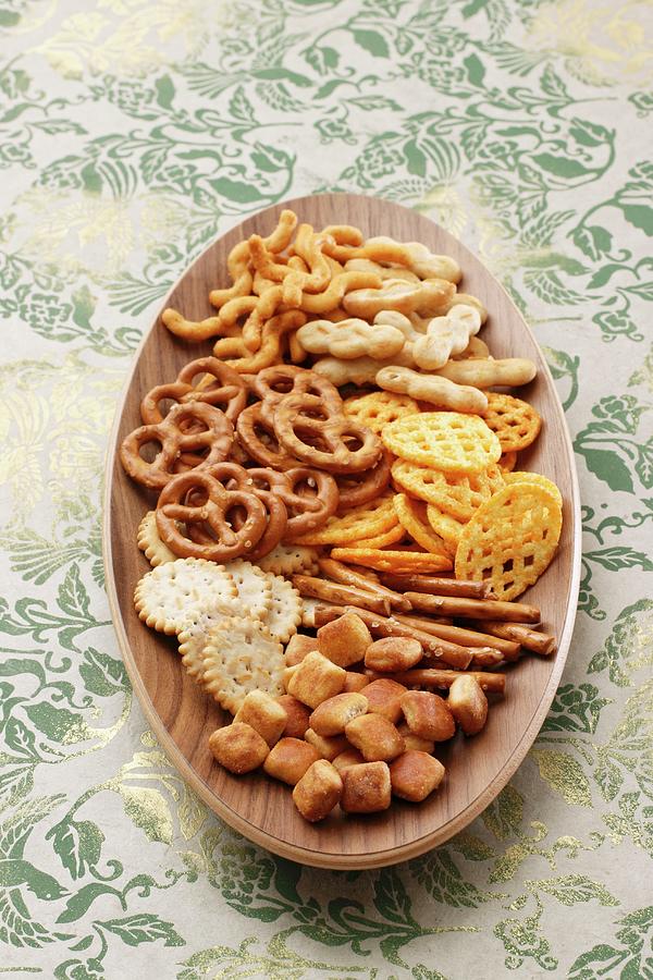 Snacks On An Oval Wooden Plate Photograph by Petr Gross