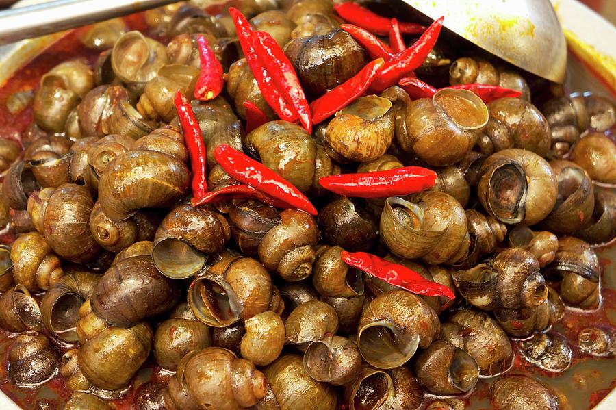 Snails With Chile At A Market In Lijiang, China Photograph by Martina ...