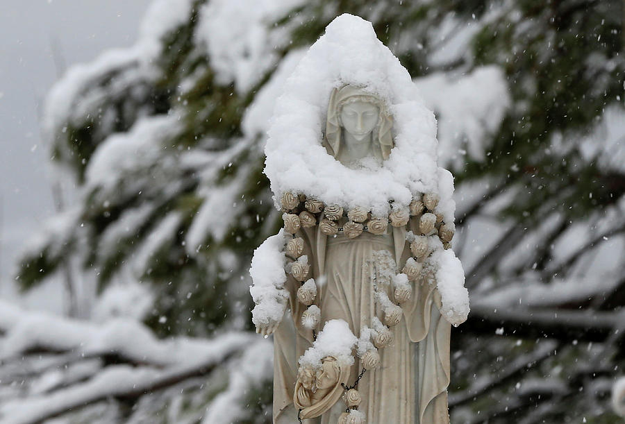 Snow Covers a Statue of the Virgin Mary Photograph by Mohamed Azakir ...