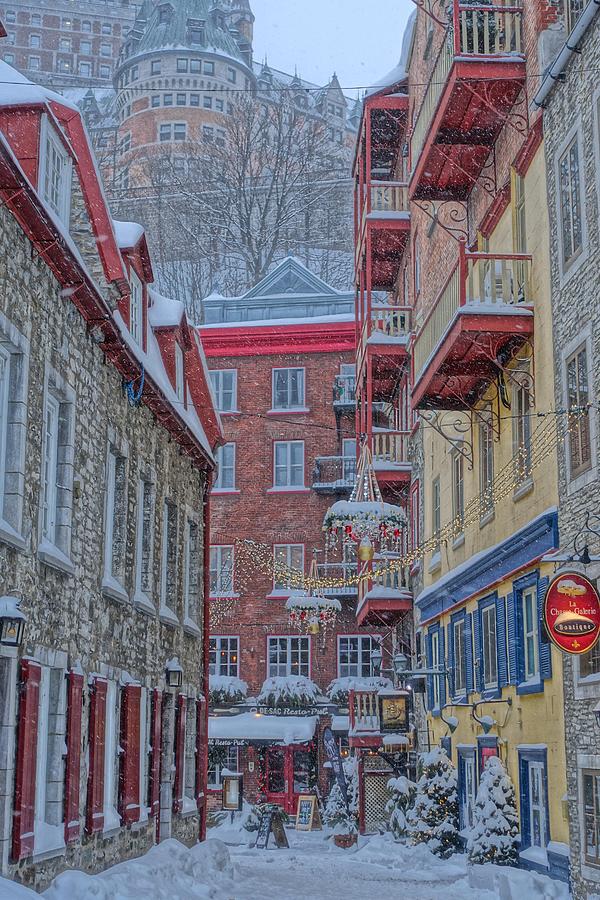 Snow falls on Quebec Citys Lower Town Photograph by Patricia Caron