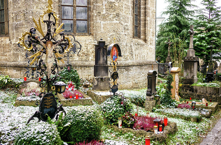 Snow on the Graves at Petersfriedhof in Salzburg Photograph by John Rizzuto
