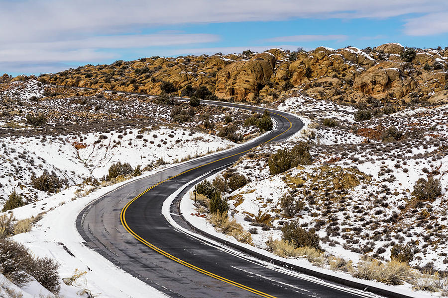Snow on the Scenic Road in Arches Photograph by Daniel Woodrum