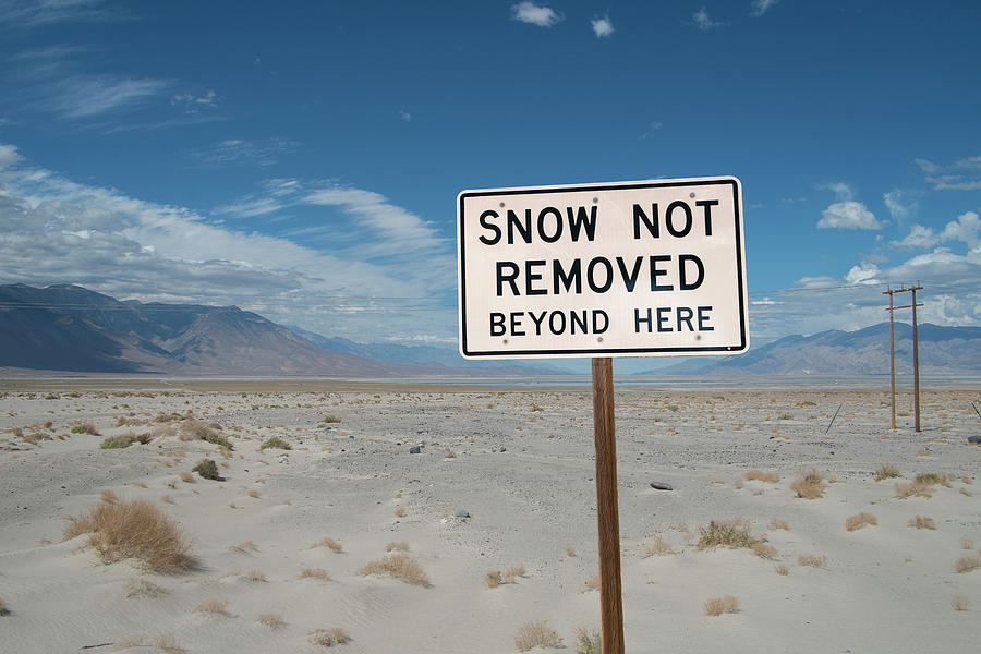 Death Valley National Park Digital Art - Snow Warning Sign In Desert, Death Valley, California, Usa by Owen Smith