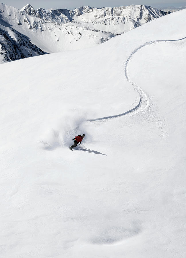 Snowboarder On Slope, Distant View Photograph by Per Breiehagen