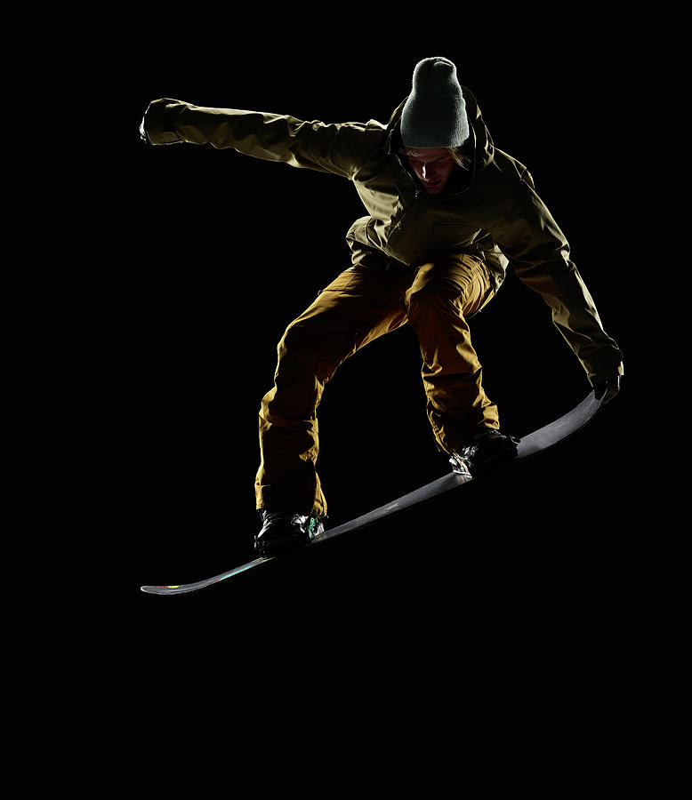 Snowboarder Pulling Front Nose Grab Mid Photograph by Lewis Mulatero