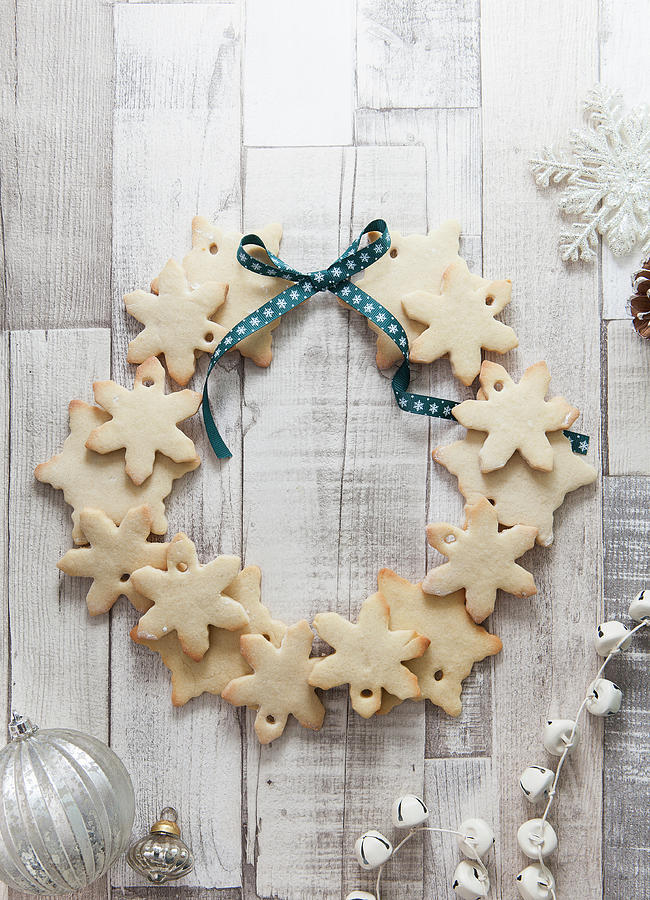 Snowflake Shaped Biscuits Arranged To Make A Christmas Wreath On A ...