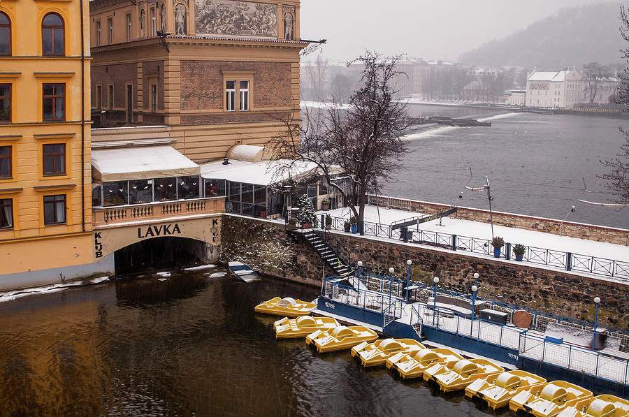 Snowy Prague. Boats Dock at Smetana Museum Photograph by Jenny Rainbow