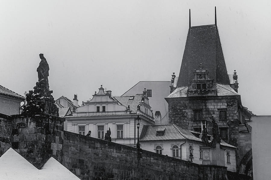 Snowy Prague. Charles Bridge and Lesser Town Tower 1 Photograph by Jenny Rainbow