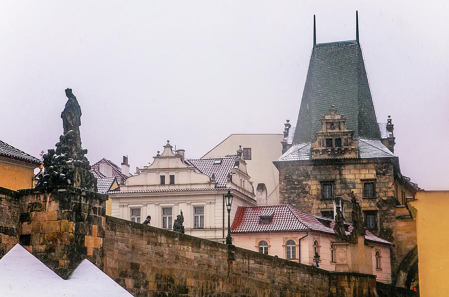 Snowy Prague. Charles Bridge and Lesser Town Tower  Photograph by Jenny Rainbow