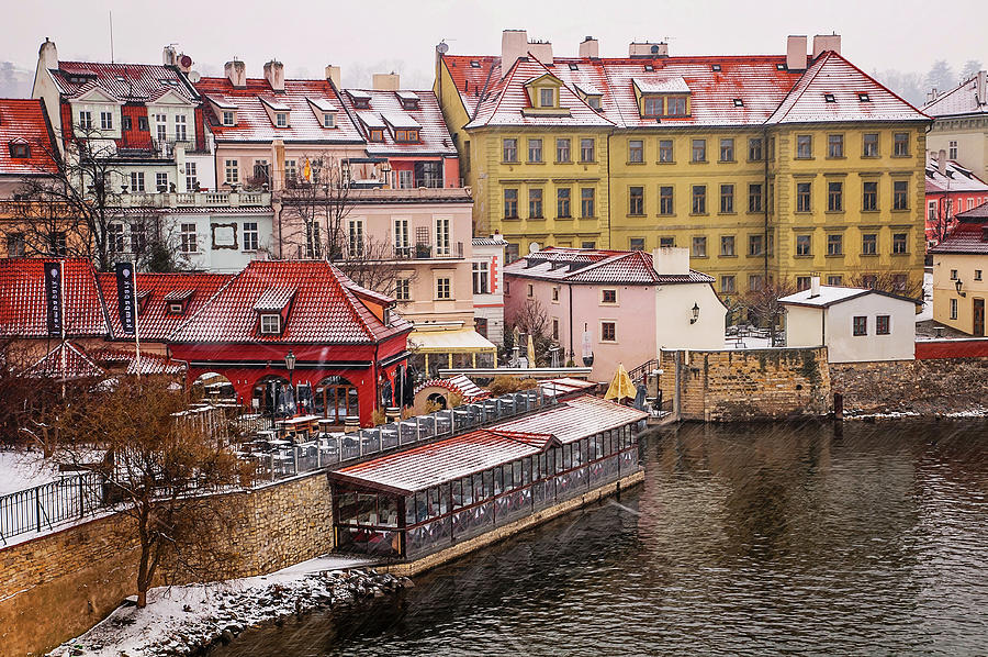 Snowy Prague. Mala Strana by Vltava River Photograph by Jenny Rainbow