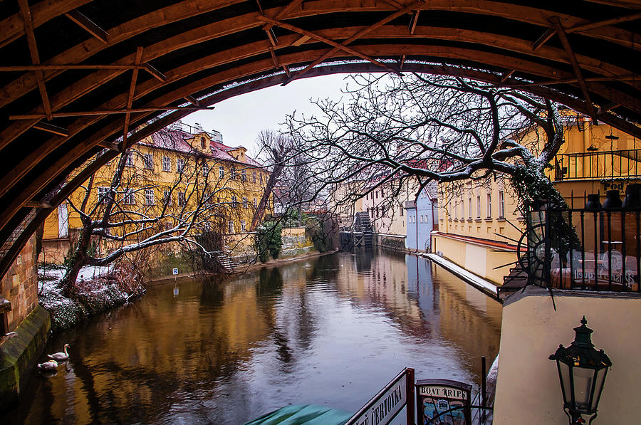 Snowy Prague. Under Bridge Photograph by Jenny Rainbow