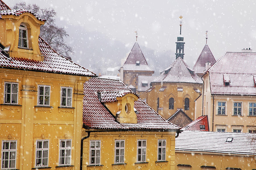 Snowy Prague. Yellow Kampa Buildings Photograph by Jenny Rainbow