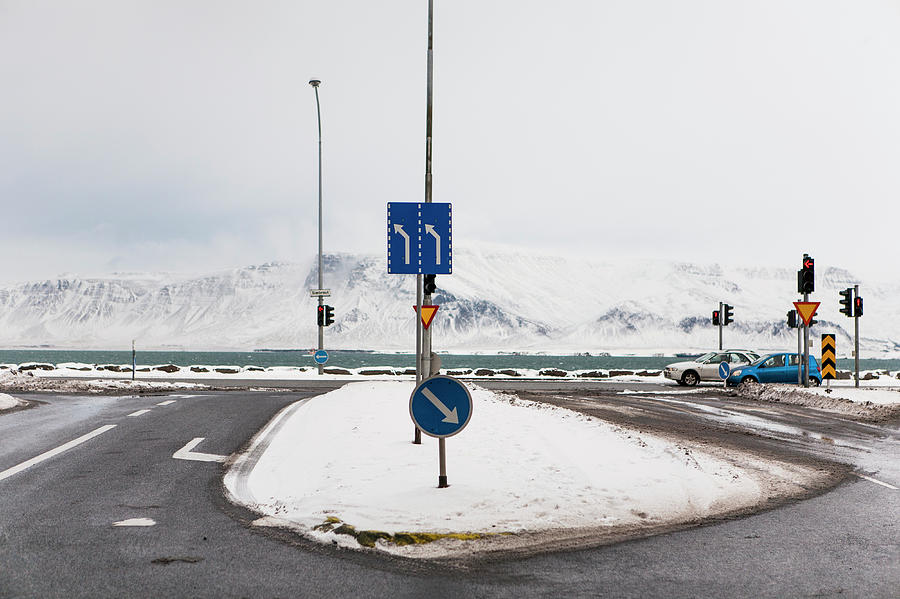 Snowy Traffic Junction Along Ocean Photograph by Merten Snijders