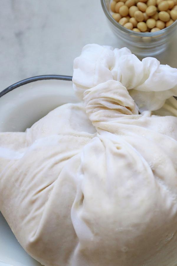 Soaked Organic Soya Beans In A Fabric Bag On A Marble Surface Photograph by Bayle Doetch
