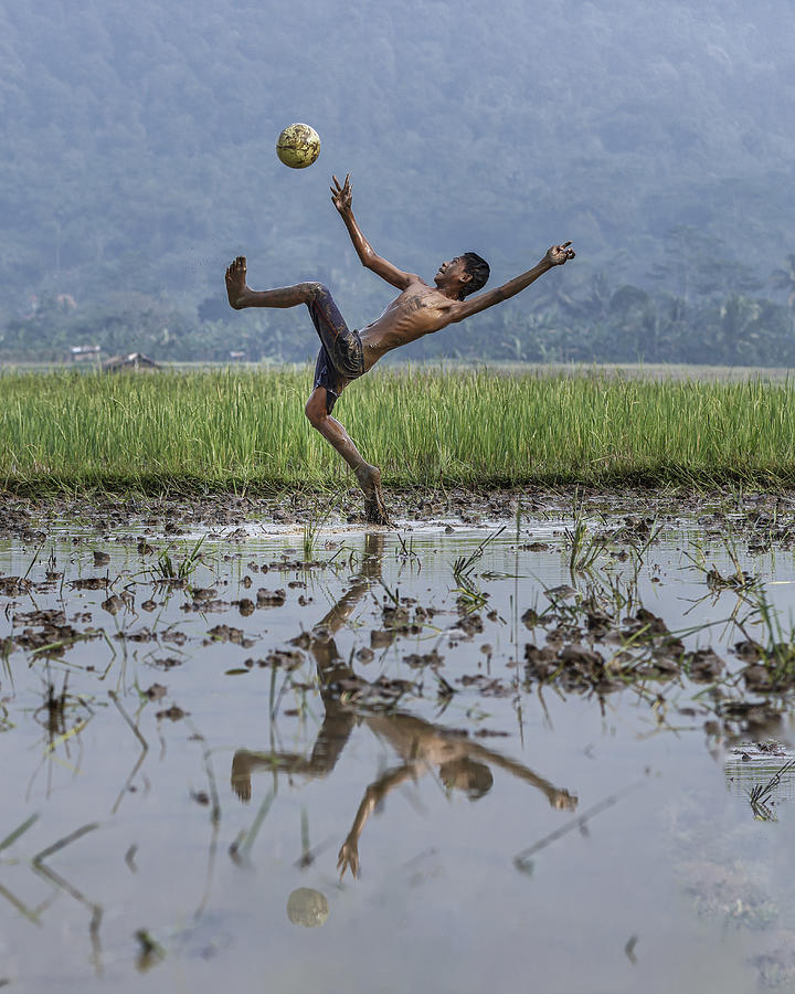 Soccer On The Mud Photograph by Gatot Herliyanto