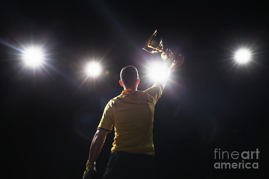 Soccer Player Holding Golden Cup Photograph by Stanislaw Pytel