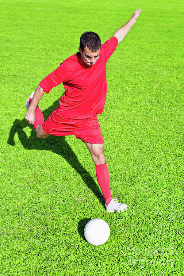 Soccer Player Kicking Ball Photograph by Microgen Images/science Photo Library