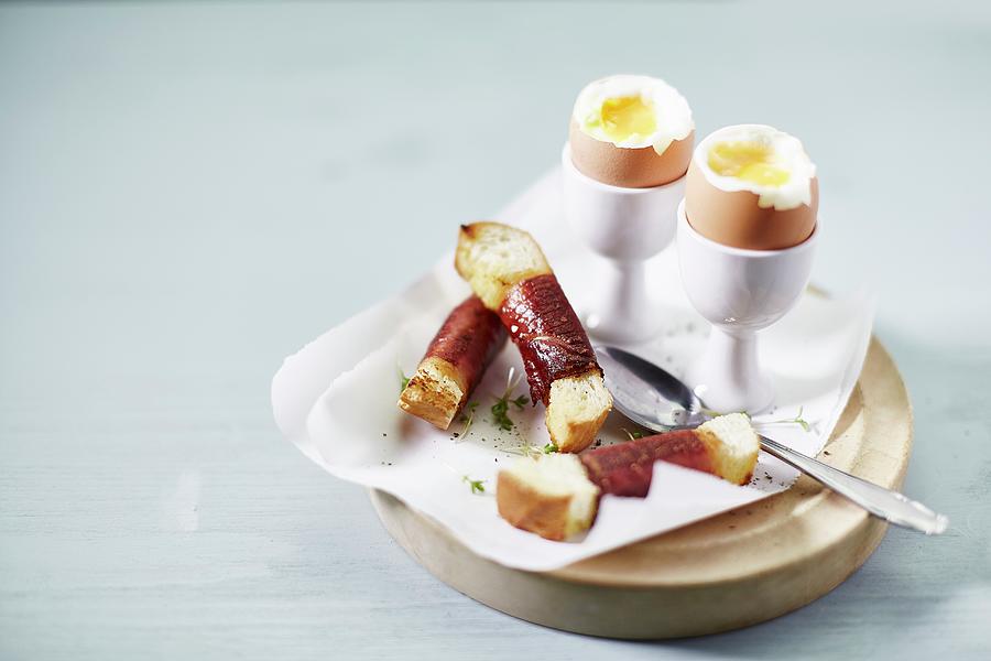 Soft Boiled Eggs And Bacon-wrapped Soldiers For Breakfast Photograph by The Stepford Husband