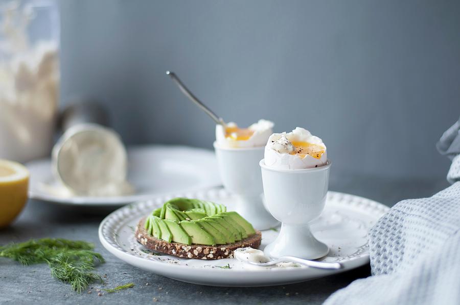 Soft Boiled Eggs And Toast With Avocado Photograph by Healthylauracom