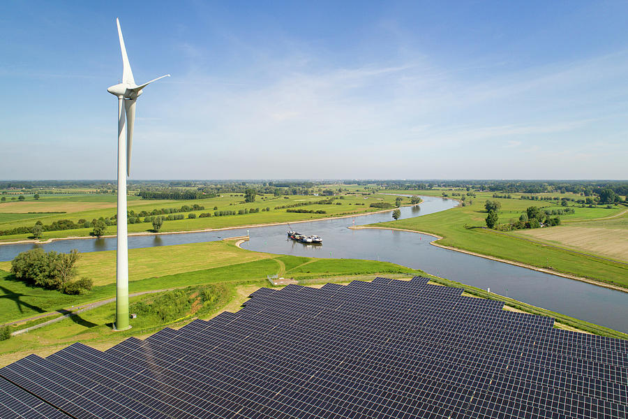 Solar Panels And Wind Turbine Near Ijssel River, The Netherlands ...