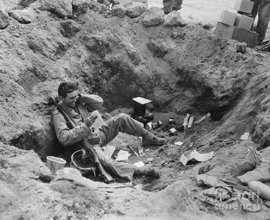 Soldier In Dugout Reading Letter Photograph by Bettmann