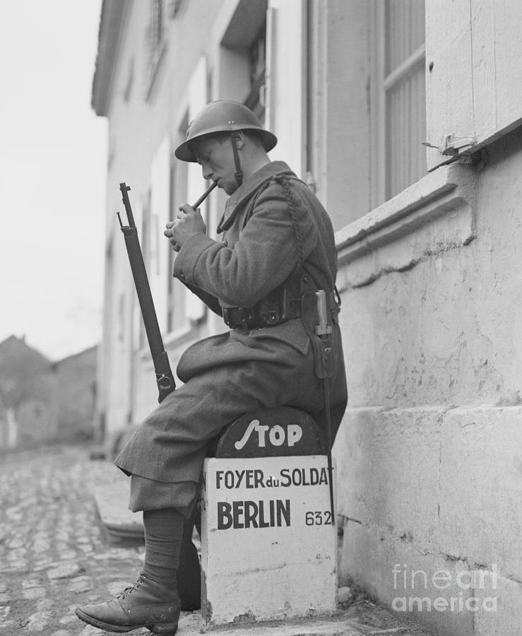 Soldier Lighting His Pipe Photograph by Bettmann