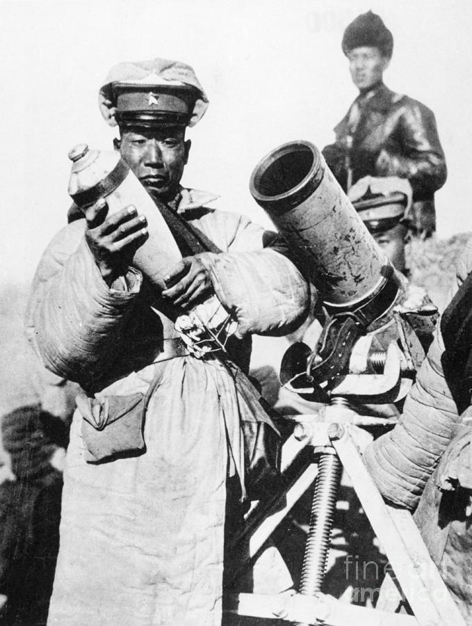 Soldier Loading Cannon Photograph by Bettmann