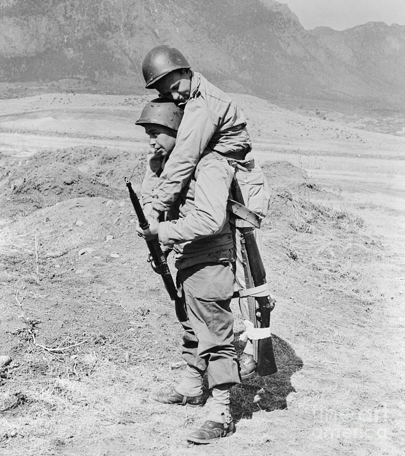 Soldier Riding Piggy Back On Another Photograph by Bettmann