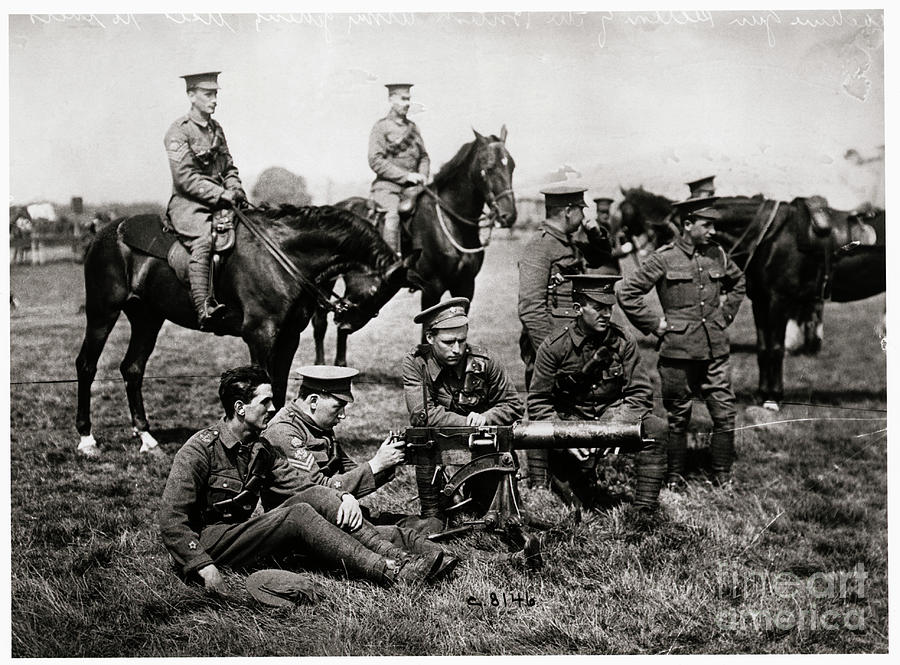 Soldiers Aiming Early Machine Gun Photograph by Bettmann
