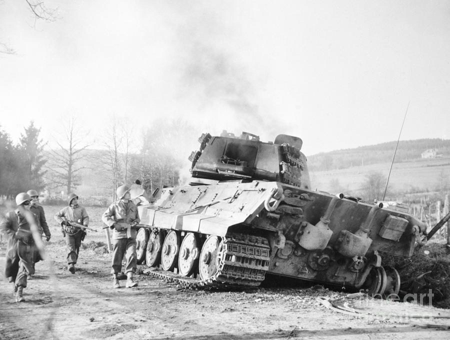 Soldiers By Burning Tank Photograph by Bettmann