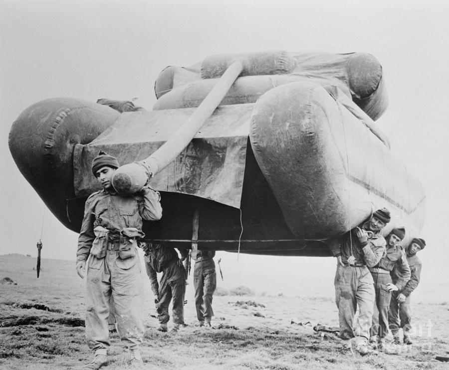 Soldiers Carrying An Inflatable Tank Photograph by Bettmann