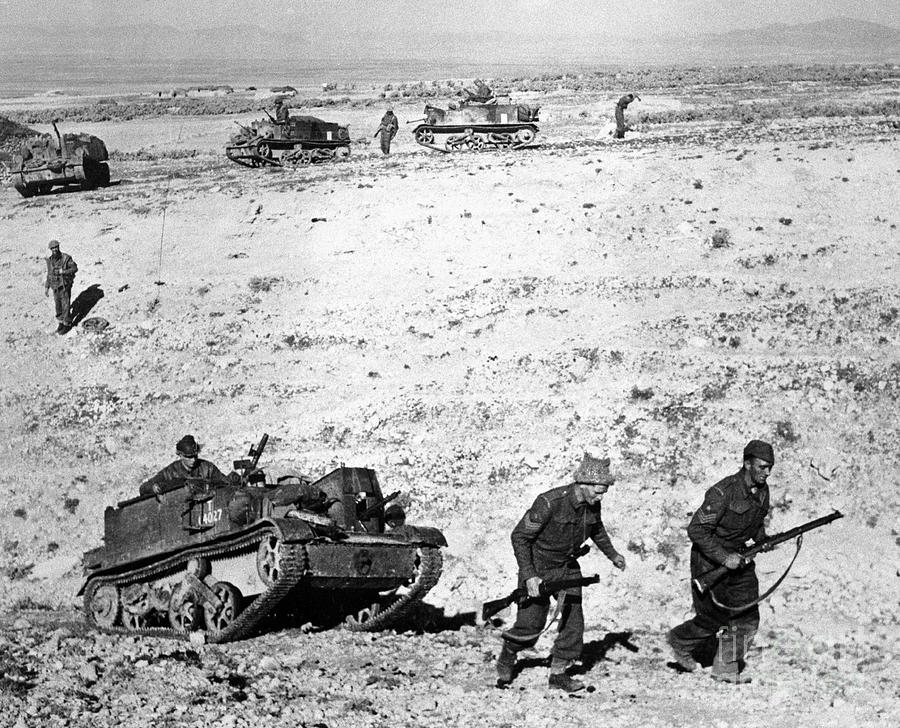 Soldiers Marching With Tank In Tunisia by Bettmann