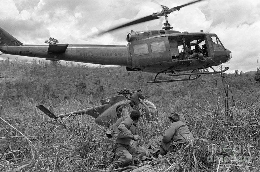 Soldiers Recovering Grounded Helicopter Photograph by Bettmann