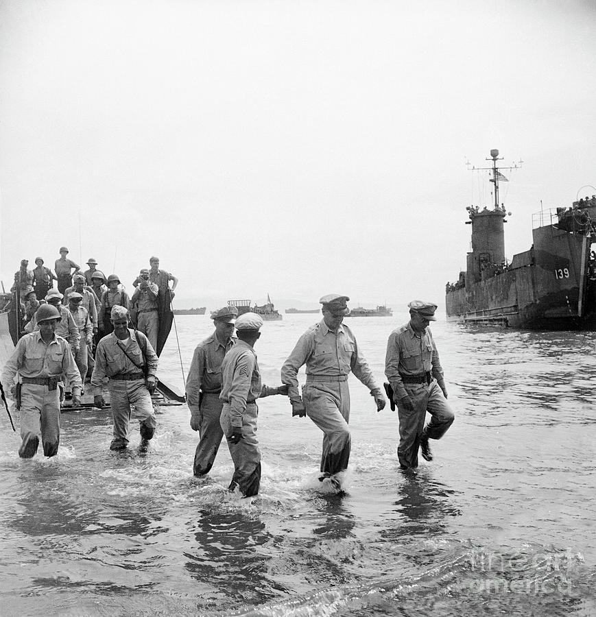 Soldiers Wading In Water On Shore by Bettmann