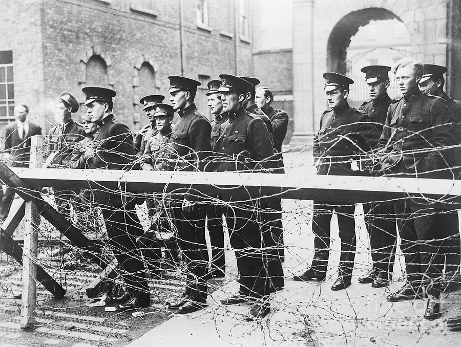 Soldiers Waiting Behind Barbed Wire Photograph by Bettmann