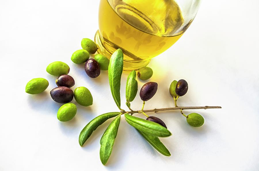 Some Olives With An Olive Branch And A Container With Olive Oil Photograph by Paulojgon