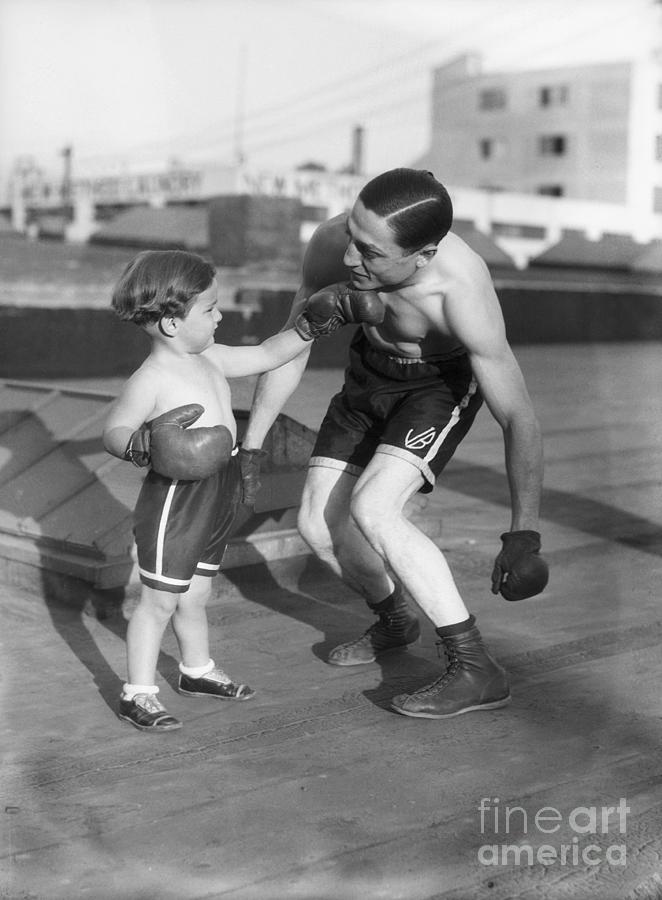 Son Giving Boxer Father Ko Punch Photograph by Bettmann